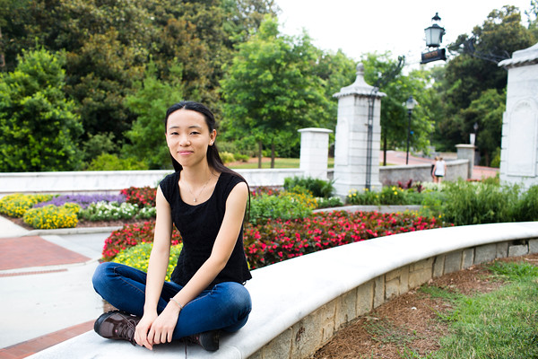 Chen Liang sits in front of Haygood-Hopkins gate